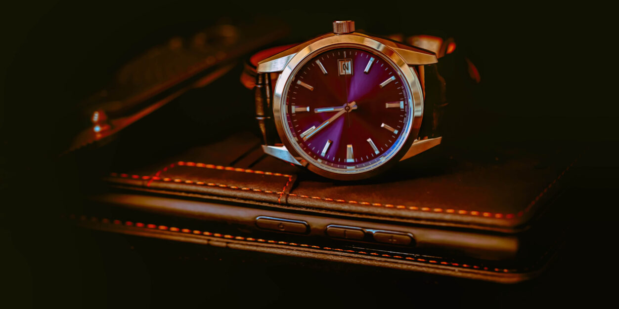 mechanical watch lies on a dark background Sell Luxury Watches